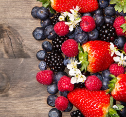 Fototapeta premium Berries on Wooden Background