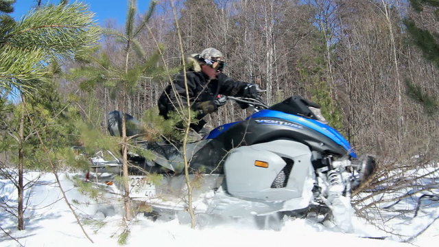 Man on snowmobile in winter