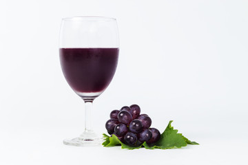 glass of wine and grapes, isolated on white