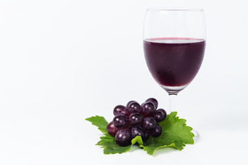 glass of wine and grapes, isolated on white