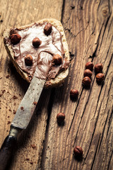 Bread spread with chocolate butter with nuts