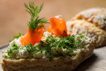 Sandwich made of cottage cheese, salmon and dill