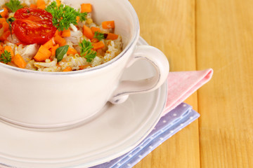 Delicious rice with vegetables and herbs in pot