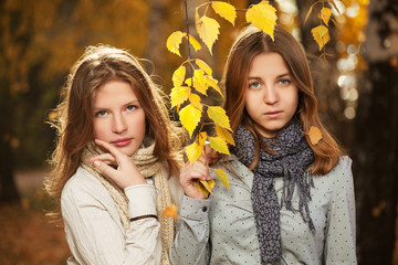 Young girls in an autumn park