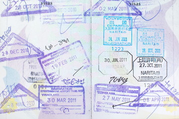 Fototapeta premium Passport stamps entering Japan, Thailand