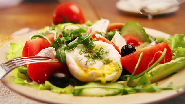 French national meal : Poached egg with salad with olive oil