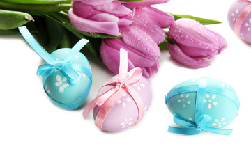 Bright easter eggs and tulips, isolated on white