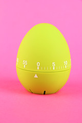 Green egg timer, on color background