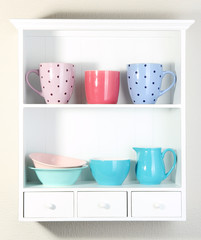 Kitchen utensils on beautiful white shelves