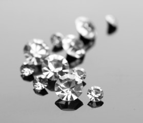 Beautiful shining crystals (diamonds), on grey background