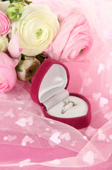 Ranunculus (persian buttercups) and engagement ring,