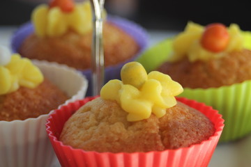 Vanilla cupcakes with lemon frosting on a cake stand