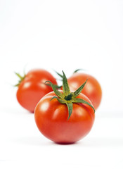 Red tomato on white background