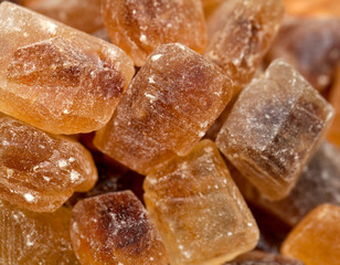brown caramelized sugar on wooden background