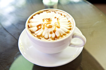 Cappuccino or latte coffee in cup