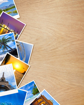 Traveling photos on wooden background
