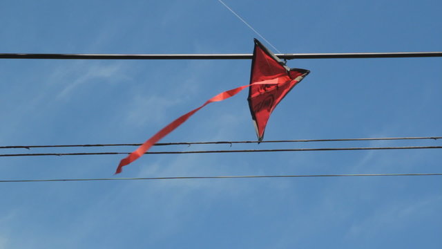 Kite stuck in wires. 2 shots.