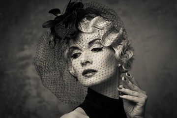 Monochrome picture of elegant blond retro woman  