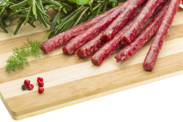 Salami with rosemary, basil and tomato