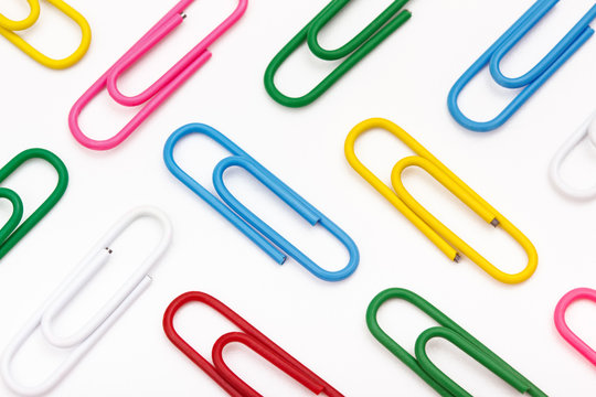the close up of colorful clips on white background