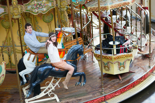 Couple on a traditional Parisian merry-go-round