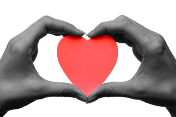 Obraz na płótnie Canvas two hands holdinr red heart symbol concept