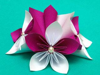 Paper flower on a green backgrounds