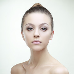 Fototapeta premium beautiful girl with perfect skin on a light background