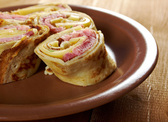 rolled pancakes stuffed ham and cheese.