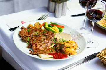 Grilled meat and baked vegetables