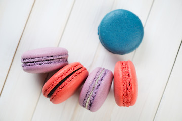 French macaroons on wooden boards, view from above