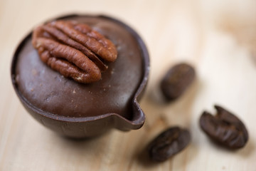 Still life food: petit four and coffee beans, close-up