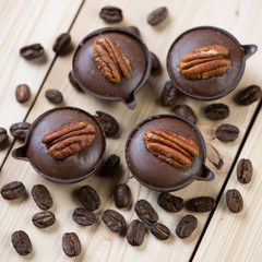 French petits fours and roasted coffee beans on wooden boards