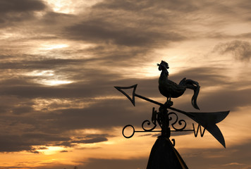 Fototapeta premium Weathercock silhouette in sunset