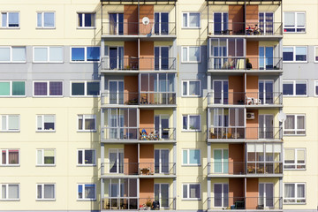 Fototapeta na wymiar Windows of a multiroom apartment house