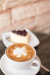 Hot coffee  and blueberry cheesecake.