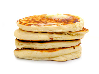 Stack of fresh breakfast pancakes over white