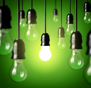 light bulbs on a green background.Idea concept.