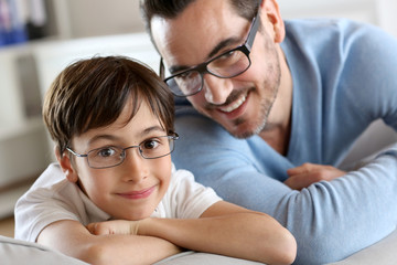 Portrait of young boy with daddy with eyeglasses on - obrazy, fototapety, plakaty