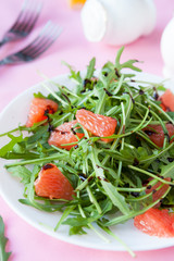 salad with fresh arugula and slices of citrus