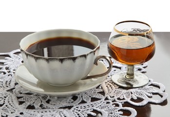 cup of coffee and glass of brandy