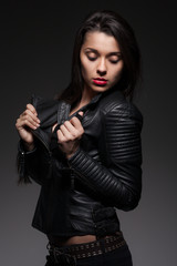Obraz na płótnie Canvas Glamorous woman in black jacket