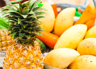 Selling tropical fruits and vegetables at market
