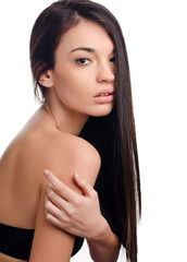 Young attractive brunette woman with gorgeous healthy long hair.