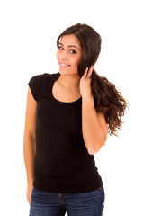 Fototapeta premium Portrait of a pretty young woman standing against white backgrou