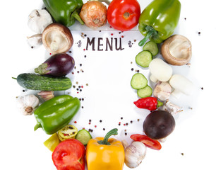 Menu surrounded by products and vegetables isolated on white