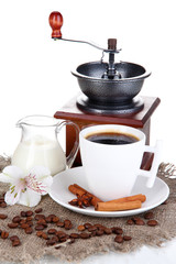 White cup of Turkish coffee with milk and coffee mill isolated