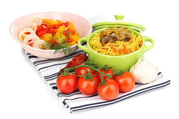 Delicious pilaf with vegetables isolated on white