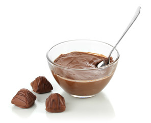 Bowl of chocolate and sweets isolated on white