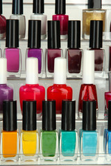 Bright nail polishes on shelf, close up